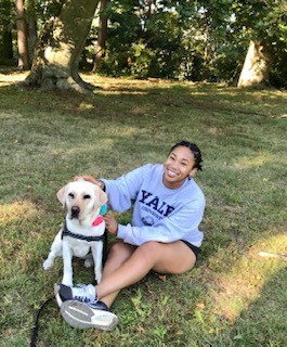 Nature Immersion Meditation participant Lauren Wiggins with Heidi the service dog