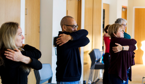 Rise and Shine participants practice self-soothing with the big hug stretch. Image credit: Heather Smith